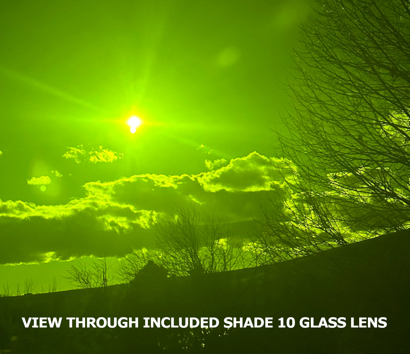 View through included shade 10 glass welding lens, showing the clarity of its greenish hue when held up to the sun.