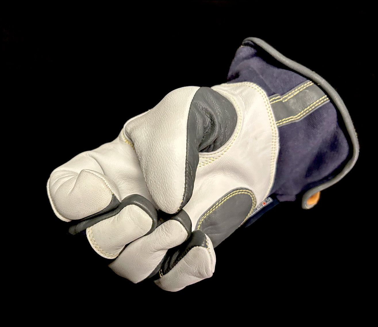 white and blue TIG glove perfectly fit on a hand
